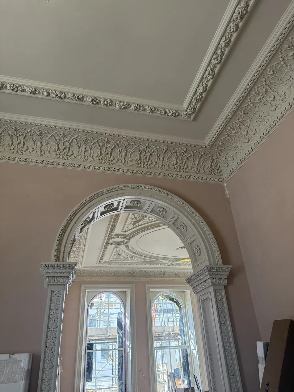 Restored enriched plaster cornice and arch at Lancaster Gate, London